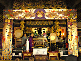 Priest preparing for a ceremony in the main hall of the Fudōson Temple, Fukagawa